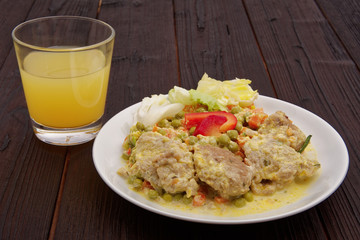 Stewed vegetables with oatmeal dumplings on a table