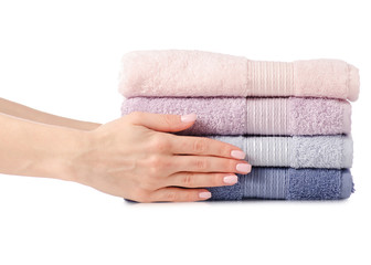 A stack of towels pink blue in hand