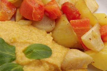 Roasted vegetables and hummus on a table