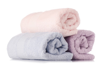 Fototapeta na wymiar A stack of towels pink blue roll