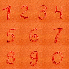 Number written on orange sand