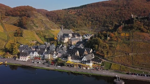 Flight over Beilstein town and autumn vineyards, Mosel valley, Germany.