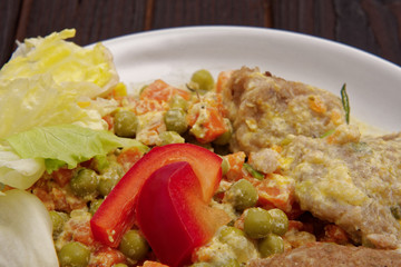 Stewed vegetables with oatmeal dumplings on a table