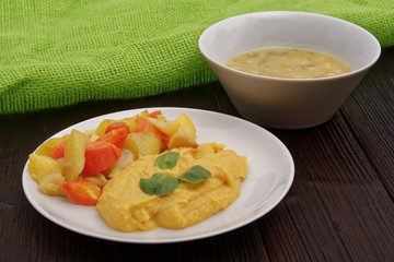 Roasted vegetables and hummus on a table