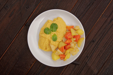 Roasted vegetables and hummus on a table