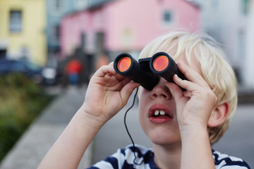 Child using binoculars