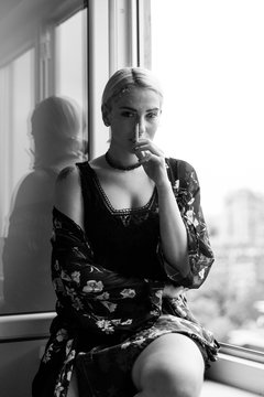 Ginger woman smoking a cigarette