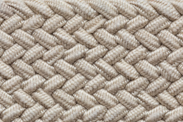Close-up wicker material texture. Braided thread structure.