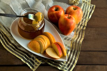 Rosh Hashanah,Traditional Jewish New Year concept.Symbolic foods are honey,apple,pomegranete and juices.Close up taken,isolated.