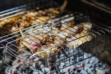 fish BBQ, the process of cooking fish on the grill