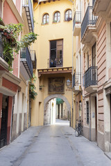 Ancient street view, historic center of Valencia, Spain.