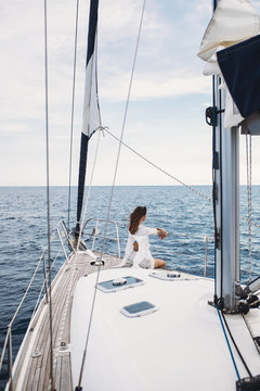 Woman Enjoying Sea on Sailboat