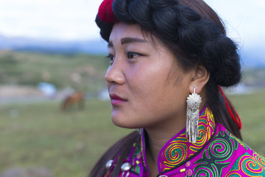 Beautiful Chinese Yi people in traditional costumes  outdoor