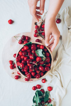 Fresh cherries in a wooden bowl