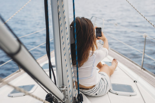 Woman Enjoying Vacation on Sailboat
