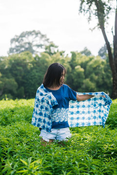 Asian woman wearing Shibori natural indigo clothes