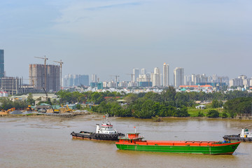 Naklejka premium Cityscape and river view of Ho Chi Minh City (Saigon). Vietnam, Southeast Asia
