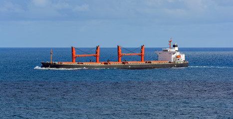 Bulk carrier vessel in high sea.