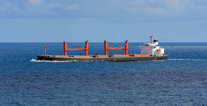 Bulk carrier vessel in high sea.