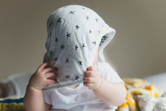 Playing peekaboo with baby