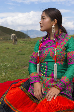 Beautiful Chinese Yi people in traditional costumes  outdoor