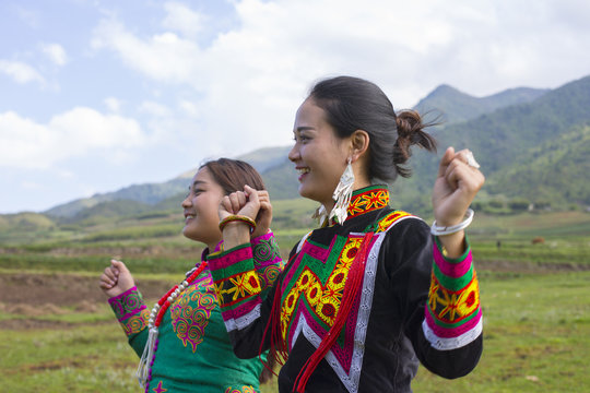 Beautiful Chinese Yi people in traditional costumes  outdoor