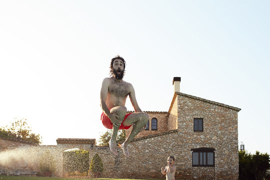 Excited man jumping high