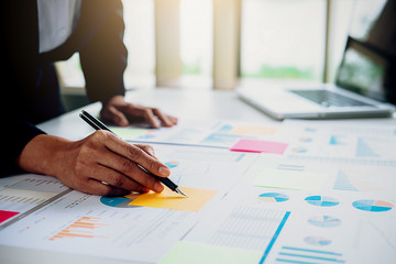 Business concept. Business people discussing the charts and graphs showing the results of their successful teamwork.