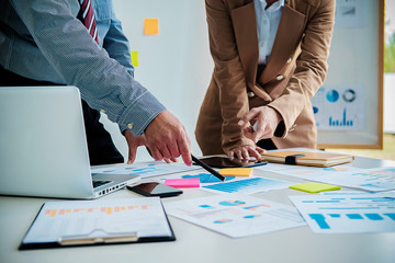 Business working at office with laptop and documents on his desk. Business concept.