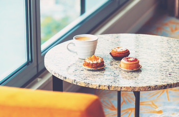 Handcrafted gourmet fruit tarts and pastries with coffee high above the city