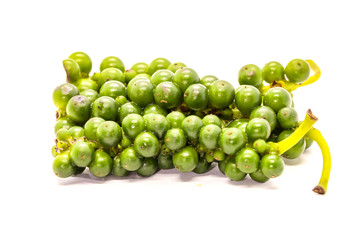 Group of fresh green peppercorns on a white background