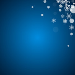 New Year snow on blue background. Winter theme. Christmas and New Year snow falling backdrop. For season sales, special offers, banners, cards, party invites, flyers. White frosty snowflakes on blue.