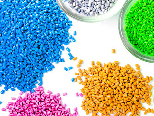 Plastic granules close up for holding,Colorful plastic granules with white background. and dollar money,Plastic Business.