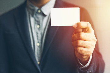 Man holding white business card,Man wearing blue shirt and showing blank white business card. Blurred background. Horizontal mockup, Smart asian business Person Professional Occupation cheerful