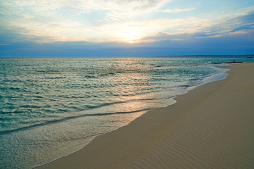 Coast of the sea at sunset. On the shore of the Caspian Sea. The Caspian Sea is the largest enclosed inland water body on Earth by area.