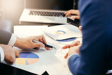 Fototapeta premium Business man working at office with laptop and documents,businessmen using documents at meeting,Teamwork Togetherness Unity Variation Support Concept,Business team 