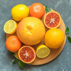 Fresh citrus fruits on table, top view.
