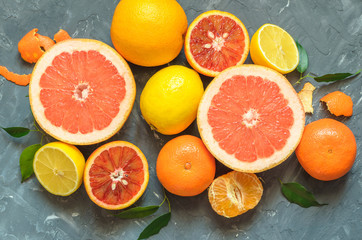 Fresh citrus fruits on table, top view.