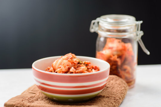 Kimchi cabbage (Korean food) in a bowl and jar