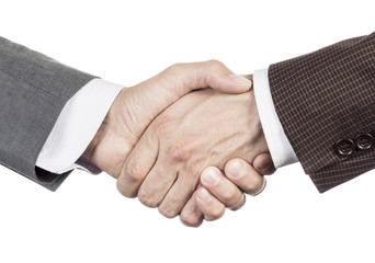 A firm handshake. Business partners shake hands. People in business suits make a handshake close-up isolated on white background. A successful business meeting. Partnership in business concept.