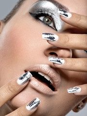 Beautiful girl with the silver makeup and nails.