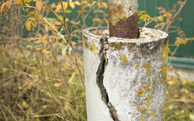 Reinforced concrete pillar with a crack; ferroconcrete column