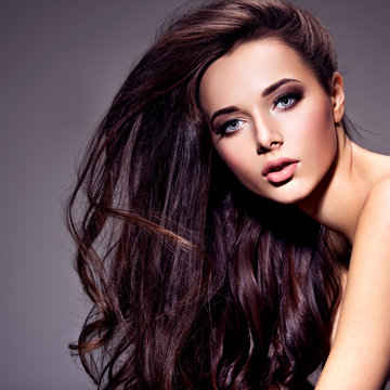 Portrait of the beautiful  young woman with long brown  hair