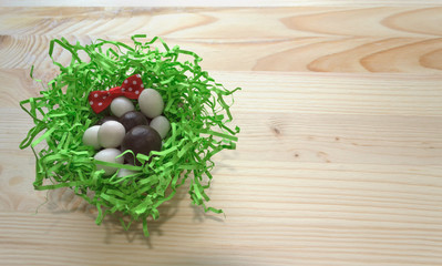 Fototapeta na wymiar candies in nest decorated with bow