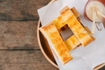 Toast Bread with Sweetened Condensed Milk Dessert Menu on wooden background