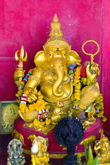 Gold sculpture of God Ganesha with the head of an elephant.