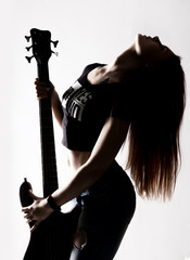 silhouette of rock woman playing on electric guitar on a white background.