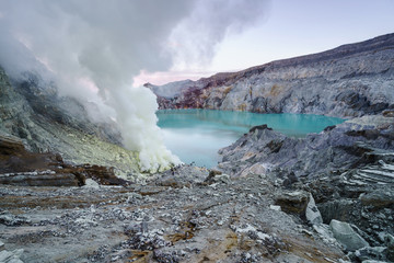 Fototapeta na wymiar Sulfur burned in the crater blue lake at Kawah Ijen