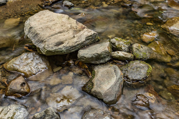 Fototapeta na wymiar stones in water