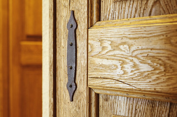 iron rusty vintage detail on wooden door from oak close-up